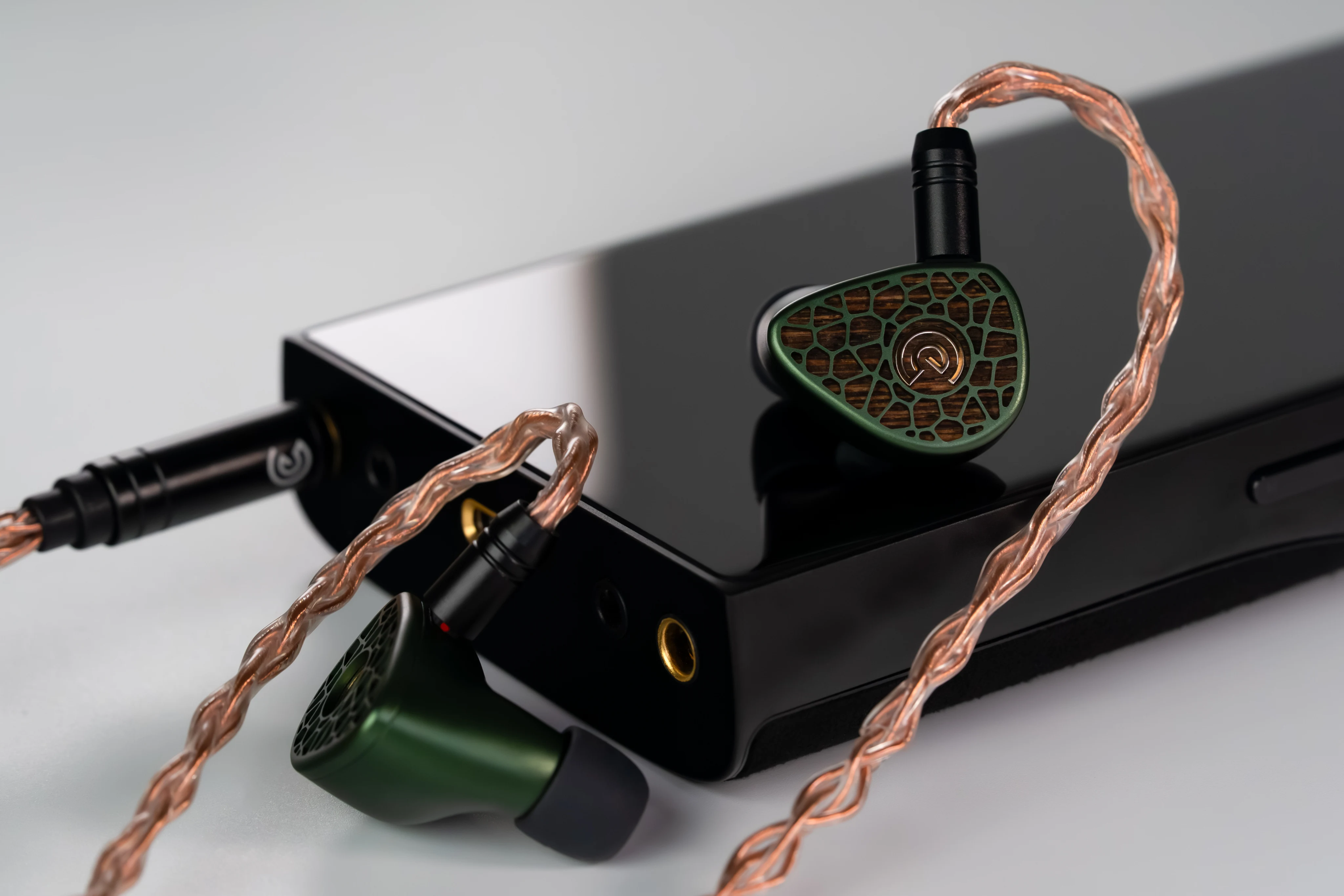 Leszy plugged into a digital audio player with the copper cable